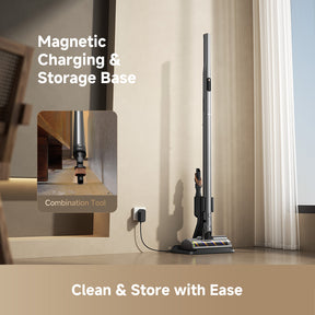 Gray cordless vacuum with wall-mounted charging and storage base, standing upright