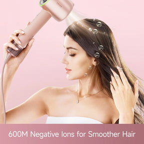 Handheld rose-gold hair dryer aimed at hair, compact nozzle and vent grille