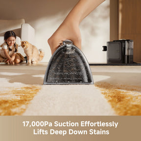 Steam spot cleaner nozzle steaming a dirty floor area beside the base unit