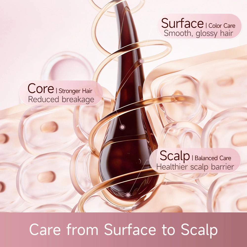 Hair care essence bottle accessory beside rose-gold hair dryer nozzle