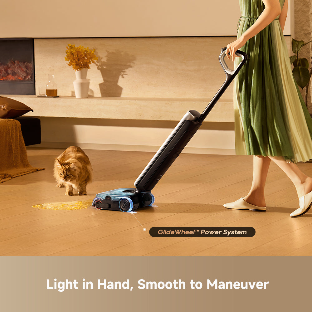 Lightweight wet/dry vacuum with floor brush head gliding on hard flooring