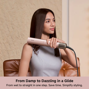 Rose-gold air straightener smoothing dark hair along the tool barrel