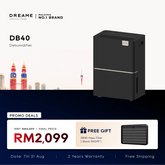 Black countertop dehumidifier with top control panel and front vent, standing upright.