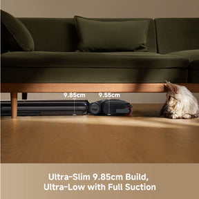Dreame wet dry vacuum slim nozzle cleaning under a sofa with a pet nearby