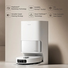 Dreame robotic vacuum docked to charging base station, front view.
